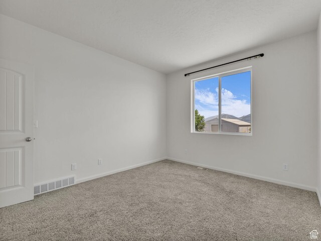 13249 S Shearing Cv, Herriman, UT 84096 - spare room featuring carpet floors