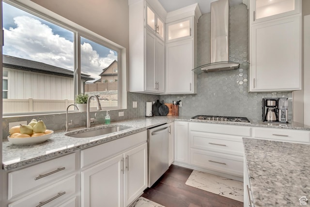 11531 S 840 W, Draper, UT 84020 - kitchen featuring wall chimney range hood, appliances with stainless steel finishes, dark wood-type flooring, decorative backsplash, and white cabinets