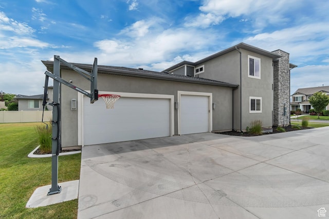 11531 S 840 W, Draper, UT 84020 - view of property exterior featuring a garage, driveway, and stucco siding