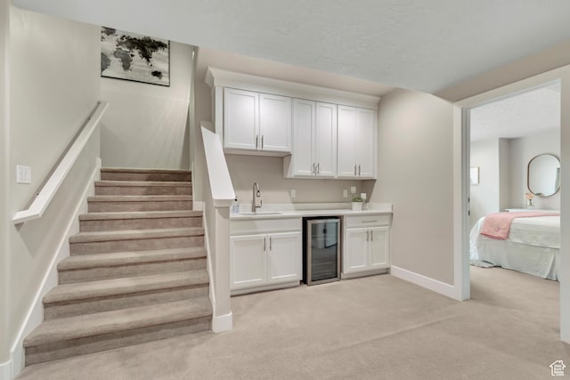 11531 S 840 W, Draper, UT 84020 - indoor wet bar featuring beverage cooler, light carpet, and stairway