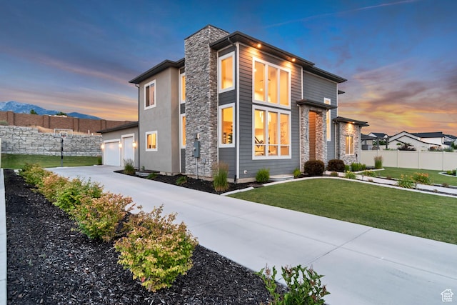 11531 S 840 W, Draper, UT 84020 - view of front of house featuring driveway, a garage, stone siding, and a chimney
