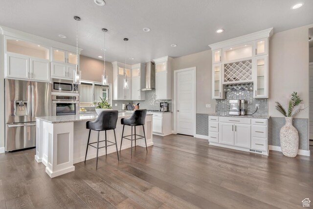 11531 S 840 W, Draper, UT 84020 - kitchen featuring appliances with stainless steel finishes, wall chimney exhaust hood, white cabinets, and recessed lighting