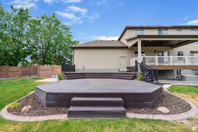 5584 N Gentle Breeze Ct, Stansbury Park, UT 84074 - rear view of house featuring a deck and stucco siding
