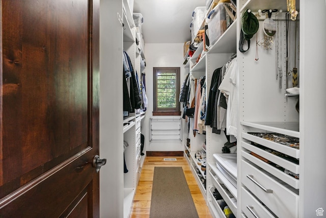 5584 N Gentle Breeze Ct, Stansbury Park, UT 84074 - walk in closet featuring light wood-style floors