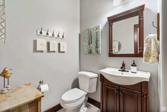 5584 N Gentle Breeze Ct, Stansbury Park, UT 84074 - half bathroom featuring vanity and toilet