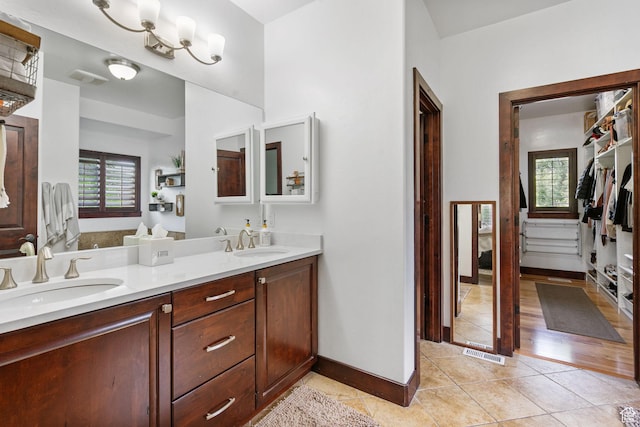 5584 N Gentle Breeze Ct, Stansbury Park, UT 84074 - full bath featuring double vanity and tile patterned flooring