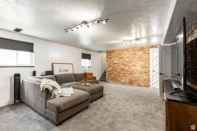 534 E 1400th St S, Bountiful, UT 84010 - carpeted living area with rail lighting, a textured ceiling, and stairway