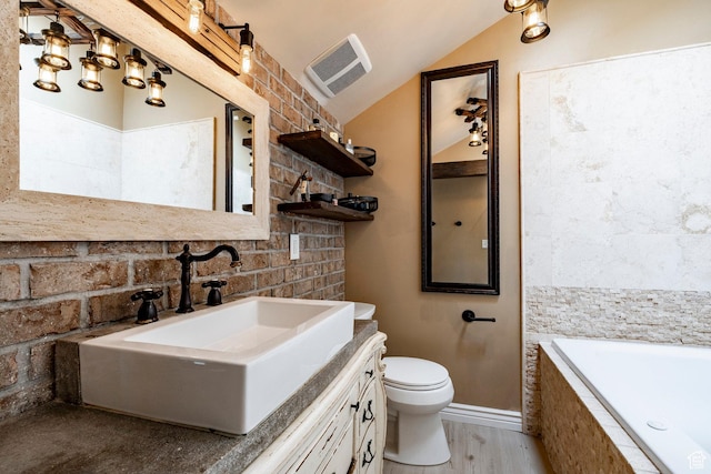 534 E 1400th St S, Bountiful, UT 84010 - full bath featuring a relaxing tiled tub, lofted ceiling, vanity, wood finished floors, and backsplash