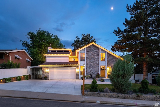 534 E 1400th St S, Bountiful, UT 84010 - view of front facade with stone siding, driveway, and an attached garage