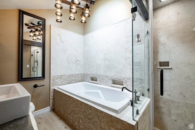 534 E 1400th St S, Bountiful, UT 84010 - bathroom with a garden tub, a stall shower, and wood finished floors