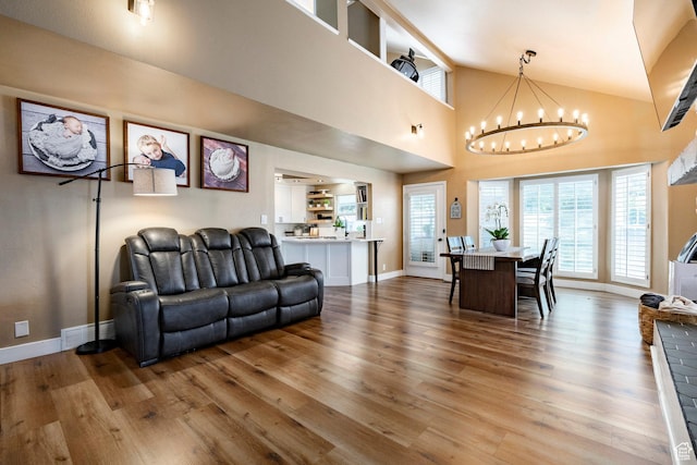 534 E 1400th St S, Bountiful, UT 84010 - living area with wood finished floors, a chandelier, healthy amount of natural light, and high vaulted ceiling