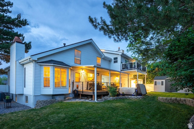 534 E 1400th St S, Bountiful, UT 84010 - back of property featuring a chimney, a lawn, a shed, and a balcony
