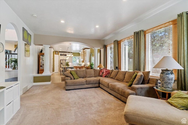 3680 N 2300 E, Layton, UT 84040 - living room featuring ornate columns, arched walkways, light colored carpet, and recessed lighting