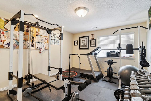 3680 N 2300 E, Layton, UT 84040 - workout room featuring a textured ceiling and baseboards