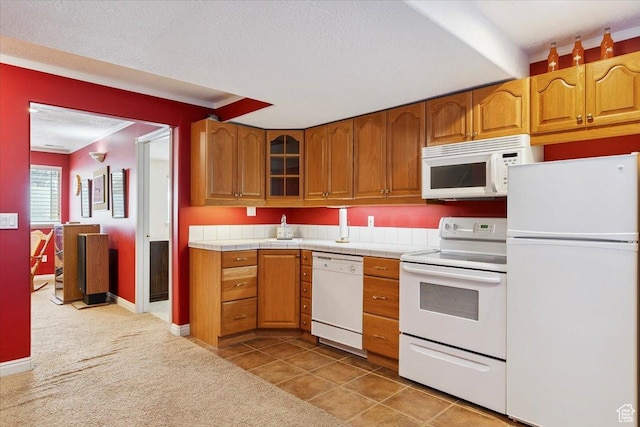3680 N 2300 E, Layton, UT 84040 - kitchen with white appliances, brown cabinets, glass insert cabinets, and a textured ceiling