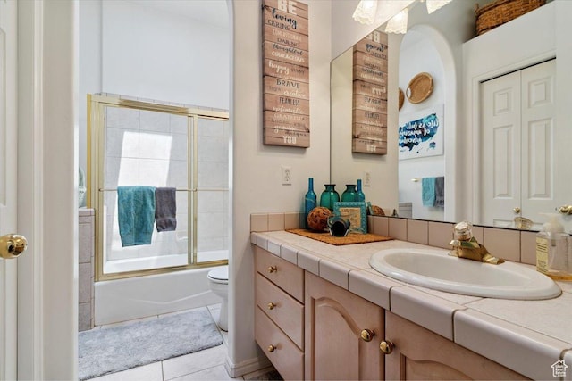 3680 N 2300 E, Layton, UT 84040 - full bathroom featuring vanity, tile patterned flooring, and bath / shower combo with glass door
