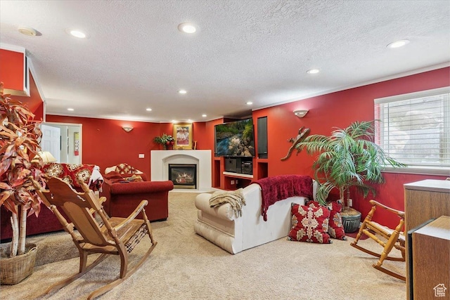 3680 N 2300 E, Layton, UT 84040 - living area with carpet flooring, recessed lighting, a textured ceiling, and a glass covered fireplace