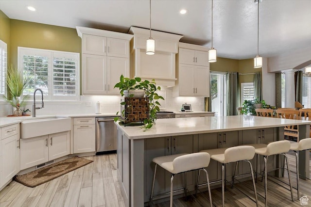 3680 N 2300 E, Layton, UT 84040 - kitchen featuring dishwasher, a center island, light countertops, tasteful backsplash, and recessed lighting