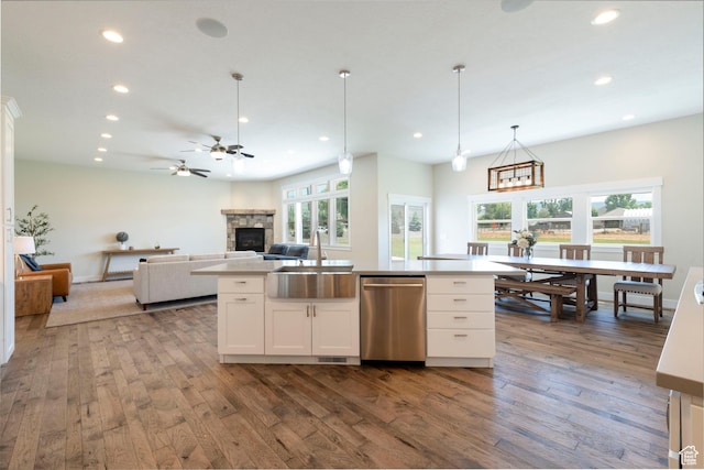 1233 S 2240 E, Heber City, UT 84032 - kitchen with stainless steel dishwasher, recessed lighting, a stone fireplace, plenty of natural light, and dark wood-type flooring