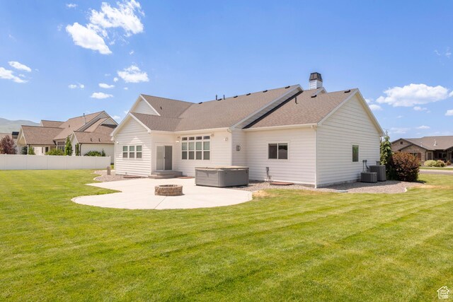 1233 S 2240 E, Heber City, UT 84032 - rear view of house featuring a patio, a hot tub, a chimney, and roof with shingles