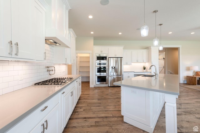 1233 S 2240 E, Heber City, UT 84032 - kitchen with stainless steel appliances, wood finished floors, recessed lighting, white cabinets, and backsplash