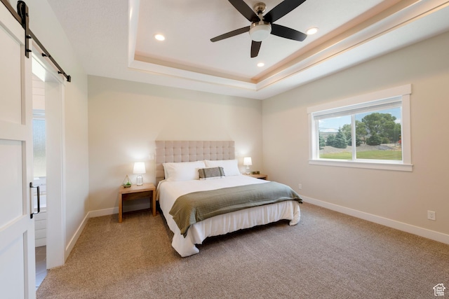 1233 S 2240 E, Heber City, UT 84032 - bedroom featuring a barn door, light carpet, a tray ceiling, recessed lighting, and a ceiling fan