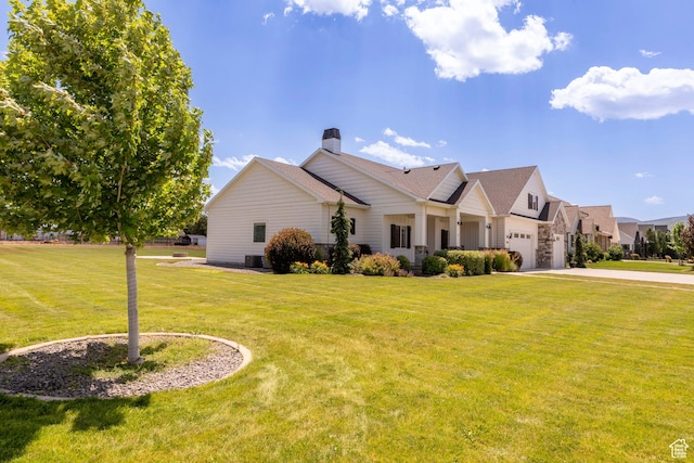 1233 S 2240 E, Heber City, UT 84032 - view of front of house with driveway, a chimney, a front lawn, and an attached garage
