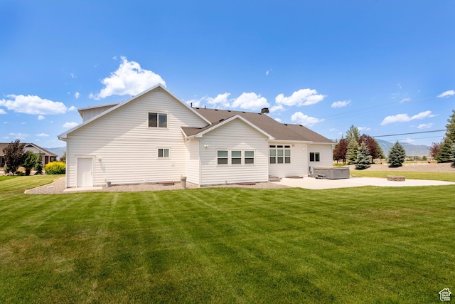 1233 S 2240 E, Heber City, UT 84032 - back of property featuring a hot tub, a patio area, and a yard