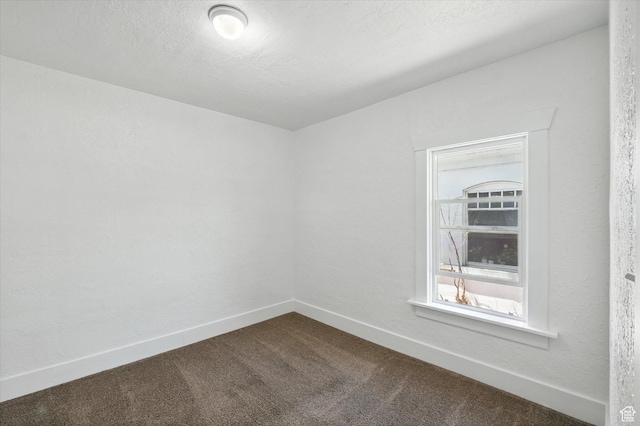 90 W 200 S, Logan, UT 84321 - unfurnished room featuring dark colored carpet and baseboards