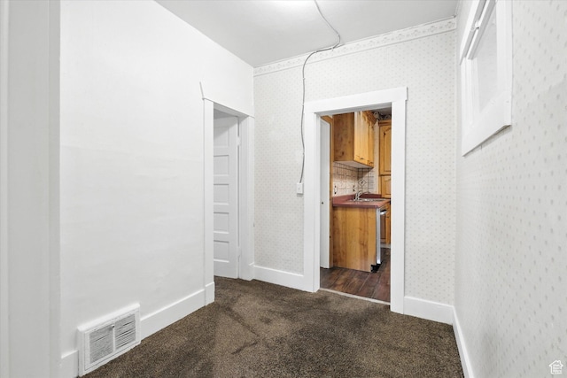 90 W 200 S, Logan, UT 84321 - hallway featuring dark carpet and wallpapered walls