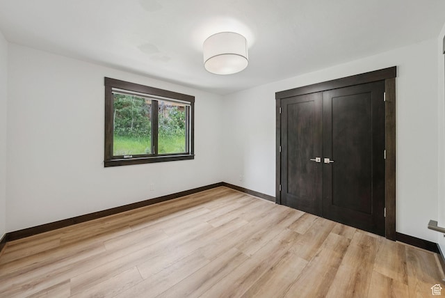 4670 Nelson Ct, Park City, UT 84098 - unfurnished bedroom featuring light wood-style flooring and baseboards