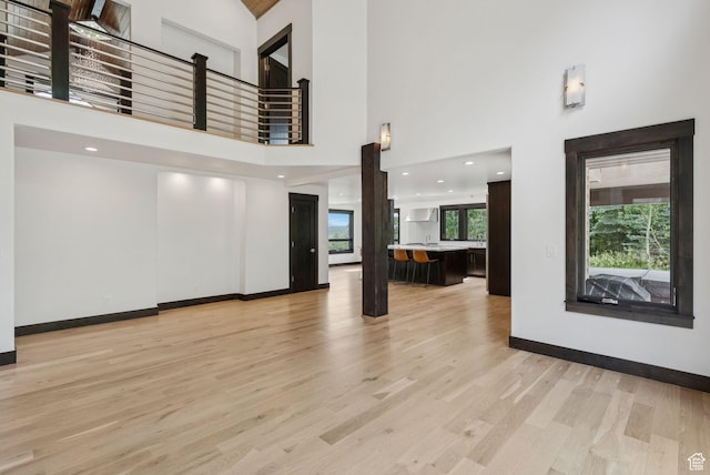 4670 Nelson Ct, Park City, UT 84098 - unfurnished living room with a high ceiling and light wood finished floors