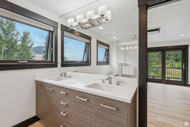4670 Nelson Ct, Park City, UT 84098 - bathroom with plenty of natural light, double vanity, wood finished floors, and recessed lighting