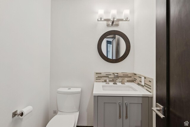 4670 Nelson Ct, Park City, UT 84098 - half bathroom featuring vanity and decorative backsplash