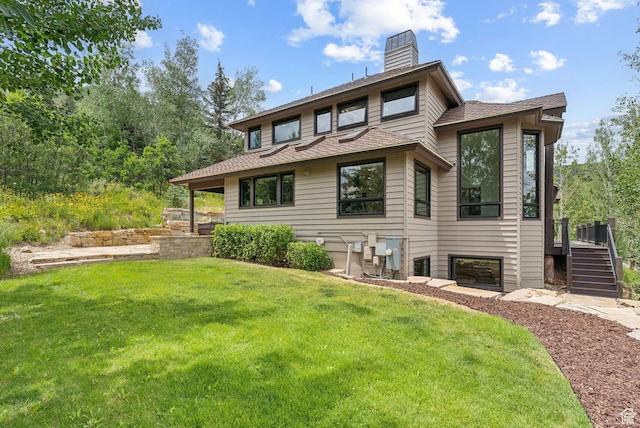 4670 Nelson Ct, Park City, UT 84098 - back of property featuring a lawn, a chimney, stairs, and roof with shingles