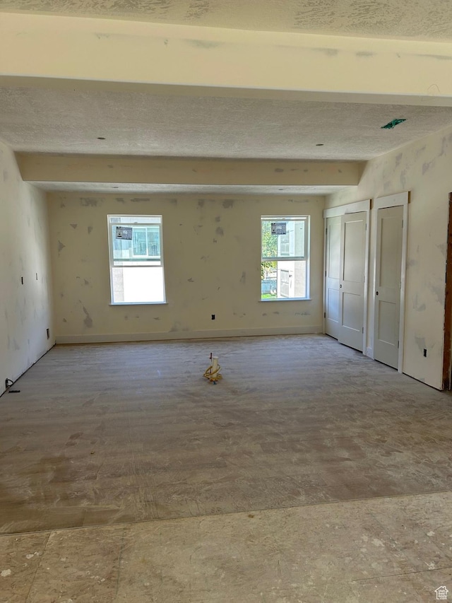 66 E 750 S Unit 23, Springville, UT 84663 - spare room featuring plenty of natural light and beam ceiling