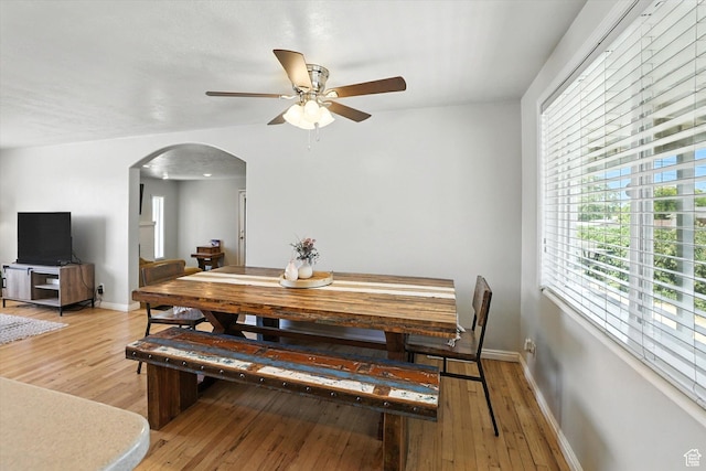 318 W 1300 N, Sunset, UT 84015 - dining room with arched walkways, a ceiling fan, and light wood-style flooring