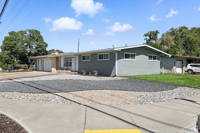 318 W 1300 N, Sunset, UT 84015 - ranch-style home with driveway, an attached garage, a chimney, and a front yard