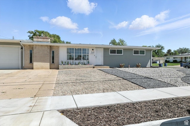 318 W 1300 N, Sunset, UT 84015 - ranch-style home with brick siding, a garage, a chimney, and driveway
