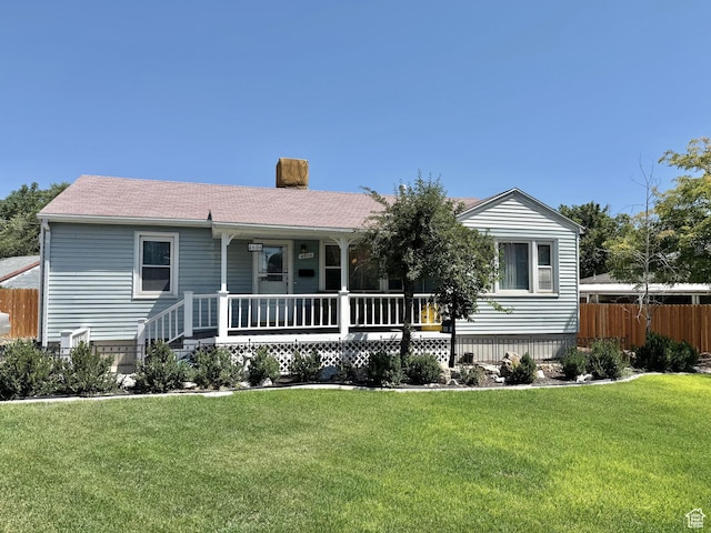 4606 W 5540 S, Kearns, UT 84118 - view of front of house with a porch and a chimney