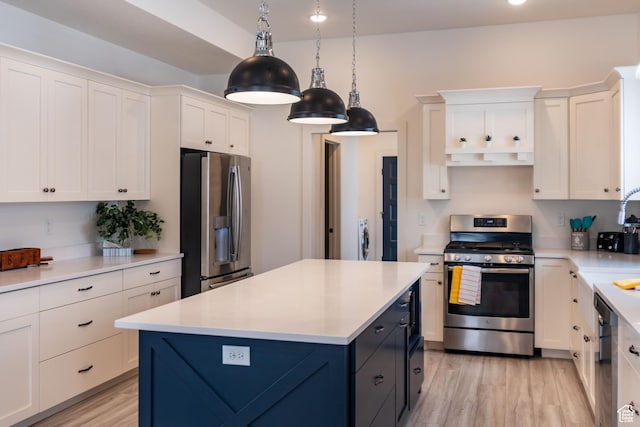 373 W Rendezvous Way N, Garden City, UT 84028 - kitchen featuring stainless steel appliances, white cabinetry, light countertops, and light wood-type flooring