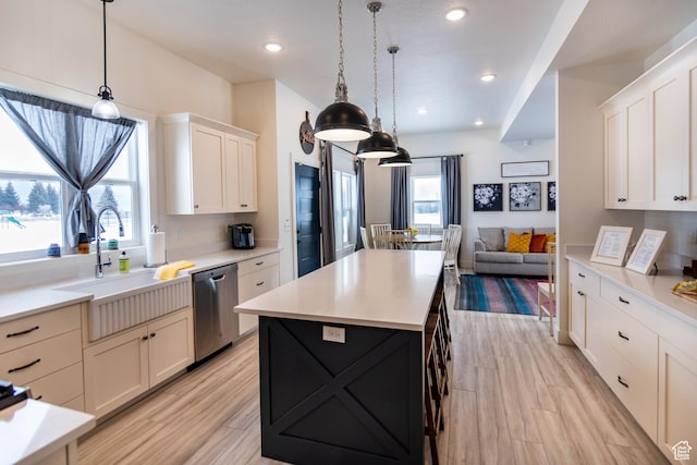 373 W Rendezvous Way N, Garden City, UT 84028 - kitchen featuring stainless steel dishwasher, open floor plan, light countertops, and recessed lighting