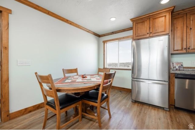 4178 E 5000 S, Vernal, UT 84078 - dining space featuring light wood-type flooring, recessed lighting, and crown molding