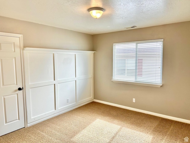 8204 N Cedar Springs Rd E Unit U-12, Eagle Mountain, UT 84005 - unfurnished bedroom with carpet and a textured ceiling