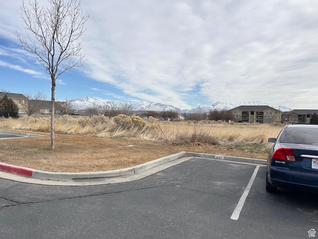 8204 N Cedar Springs Rd E Unit U-12, Eagle Mountain, UT 84005 - view of asphalt street with curbs and a mountain view