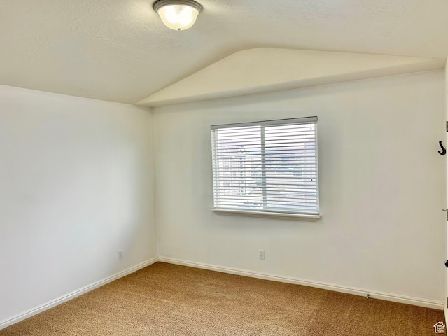 8204 N Cedar Springs Rd E Unit U-12, Eagle Mountain, UT 84005 - unfurnished room with vaulted ceiling, carpet flooring, and a textured ceiling