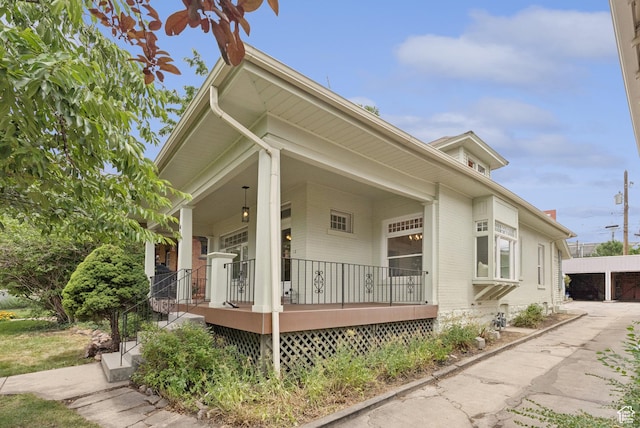 467 S 1300 E, Salt Lake City, UT 84102 - view of home's exterior featuring a porch and brick siding
