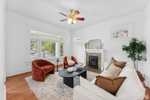 467 S 1300 E, Salt Lake City, UT 84102 - living room featuring wood finished floors, ceiling fan, and a tile fireplace