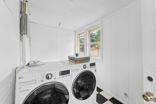 467 S 1300 E, Salt Lake City, UT 84102 - washroom featuring washing machine and dryer, tile patterned floors, and a decorative wall