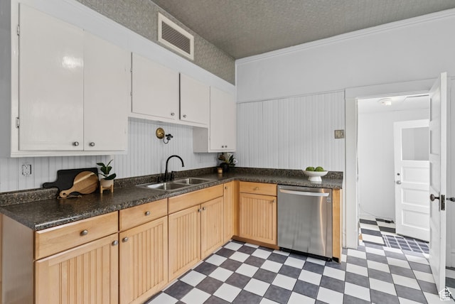 467 S 1300 E, Salt Lake City, UT 84102 - kitchen featuring dishwasher, tile patterned floors, dark countertops, wainscoting, and white cabinets